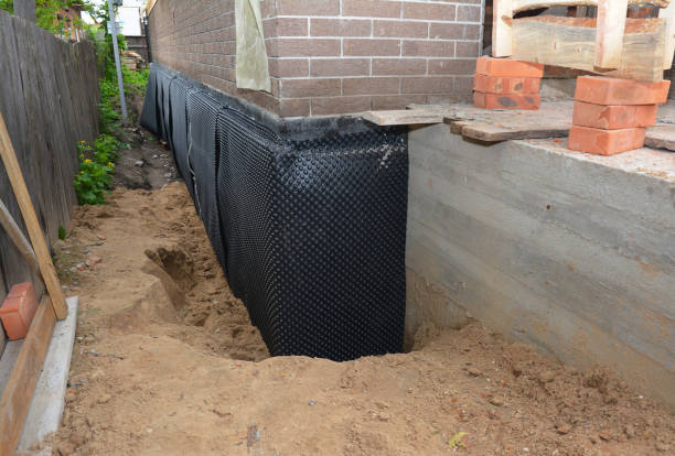 SJ Waterproofing Pros technician performing targeted Exterior Waterproofing assessment in Monroeville, IN